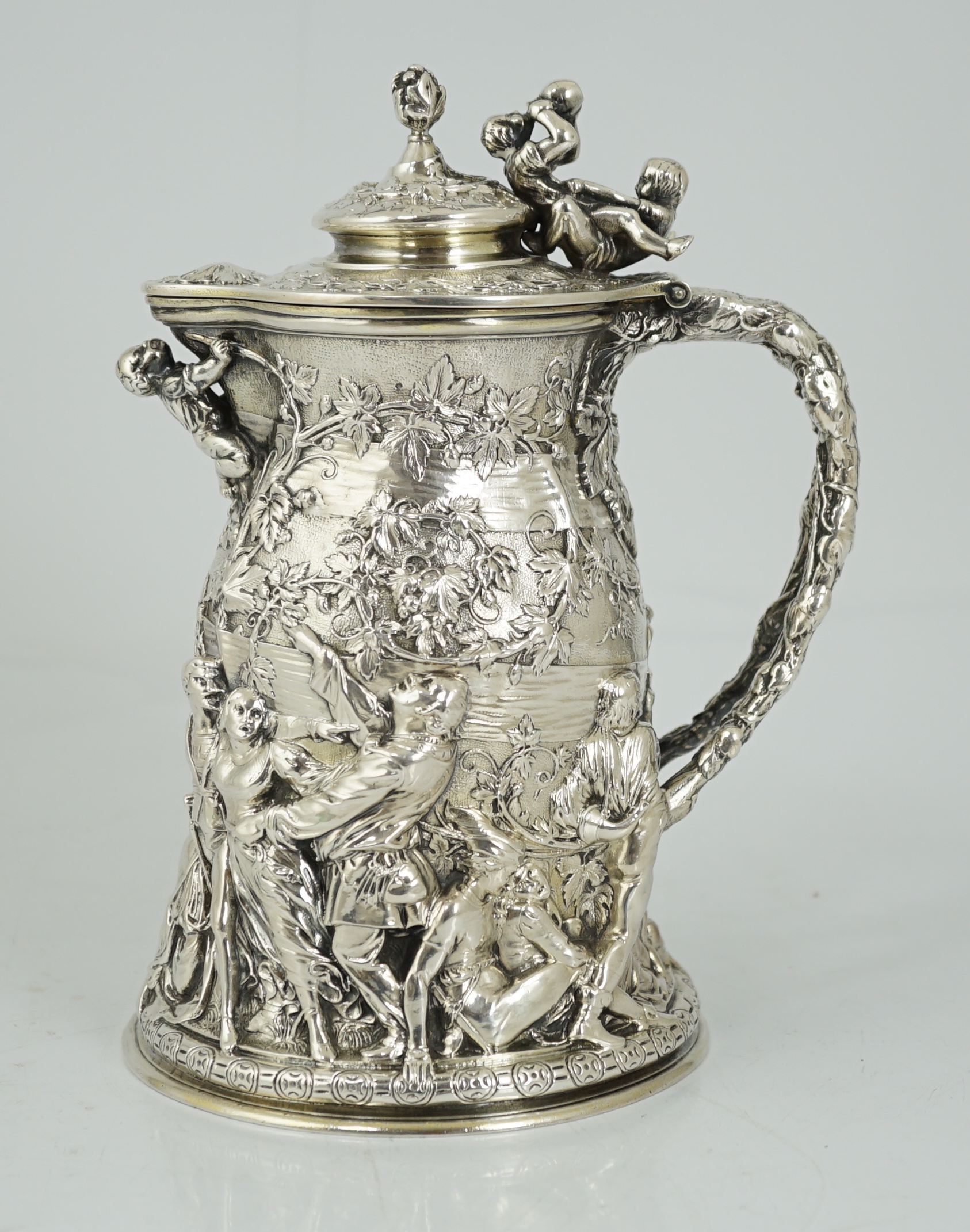 ROYAL INTEREST: A good ornate Victorian Teniers style silver ewer with hinged cover by Frederick Elkington